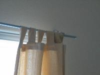 upstairs back bedroom - fix curtain rod