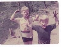 Not sure if the date on this is correct or not. Steve and Scott on a teacher camping trip, playing on a mud slide. 