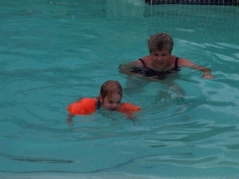 Grandma D chases Jordan in the pool