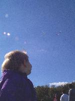 Jada looking up at kites