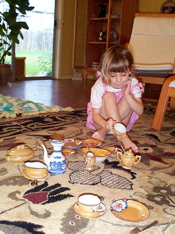Jordan playing with the china that originally belonged to her Great-Grandma Mendell 