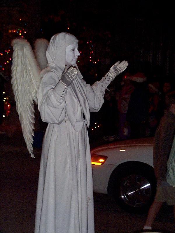 a lady pretending to be an angel statue