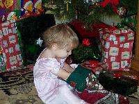 Jada reaching into her stocking