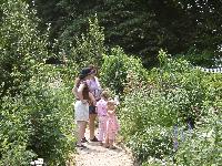Julie, Deborah Katz, and the girls in the garden