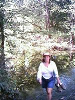 Julie crossing the creek