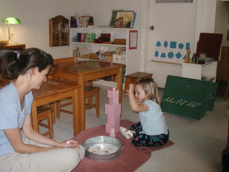 Little Elena Collins working the pink tower