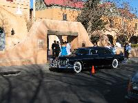 a wedding in the old churnch, with an antique limo