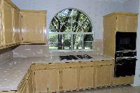 kitchen, with a window looking over the side yard