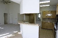 standing in the breakfast area, looking back at the kitchen and family room