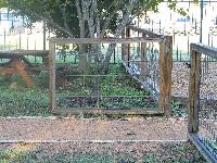 hog wire fence gate that needs a diagonal brace