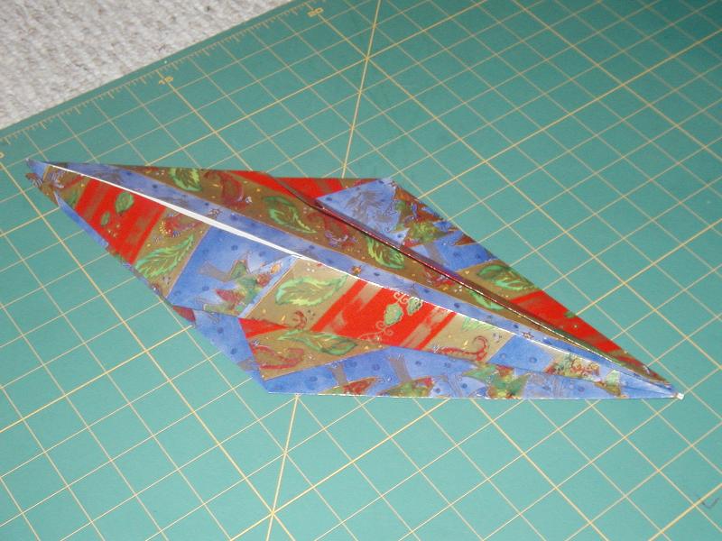 Fold in the top layer of each side, to meet the middle.