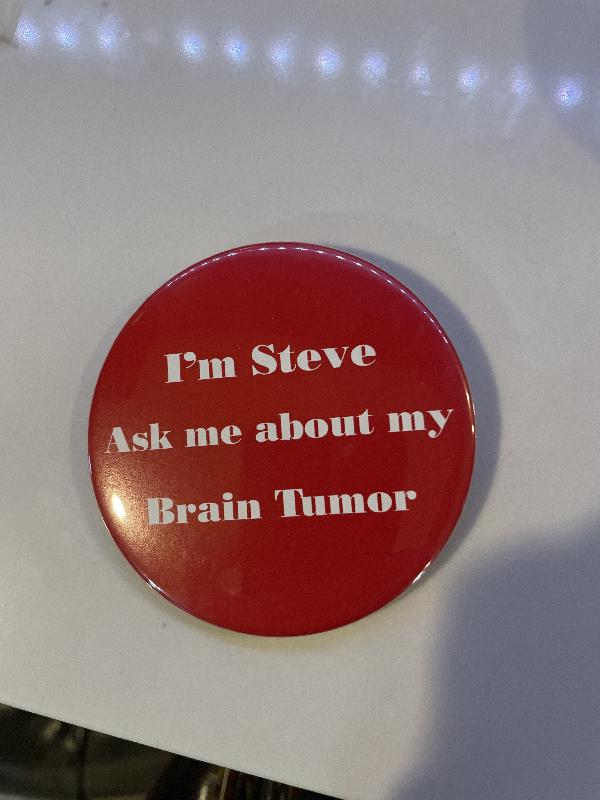 A button Mom had made for me. I seemed to like telling people my story even very early. 