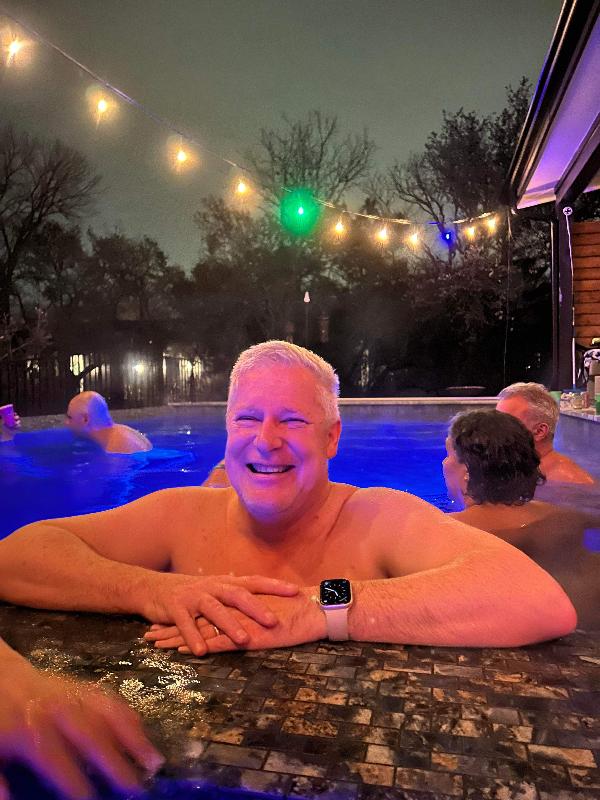 Me in my roommate's pool, January 2024