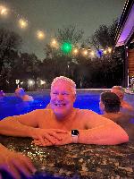 Me in my roommate's pool, January 2024