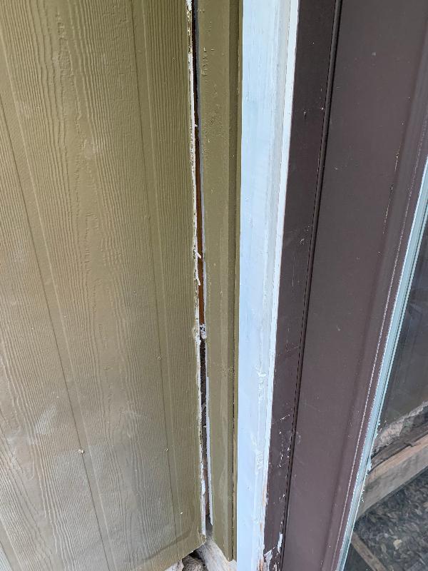 November 2023 - Photo by pest control showing laundry room addition separating from house near deck 
