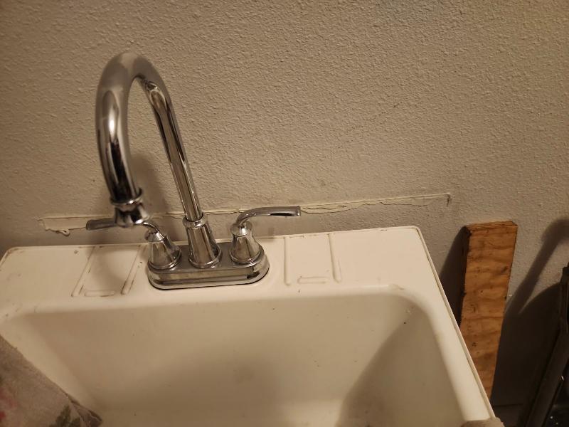 December 2023 - Photo from tenants showing that Laundry room sink has moved relative to the wall. 