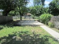 Backyard with parking pad, access via alley between 3rd St and 2nd St. 