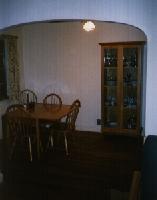 Wide shot of the drop leaf table I built of solid red oak and the china cabinet I built. 