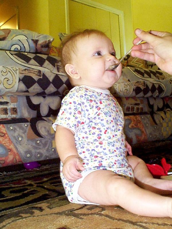 Jada eating applesauce