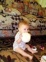 Jada finishes the applesauce and starts on the bowl