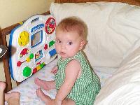 Jada playing in the crib