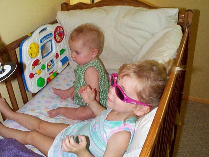 Jordan and Jada in the crib, with shades