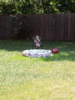 Jordan in a chair by the pool