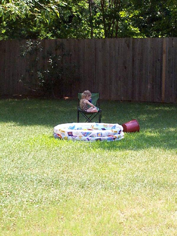 Jordan lounging by the pool