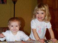 Jordan and Jada smiling on the couch