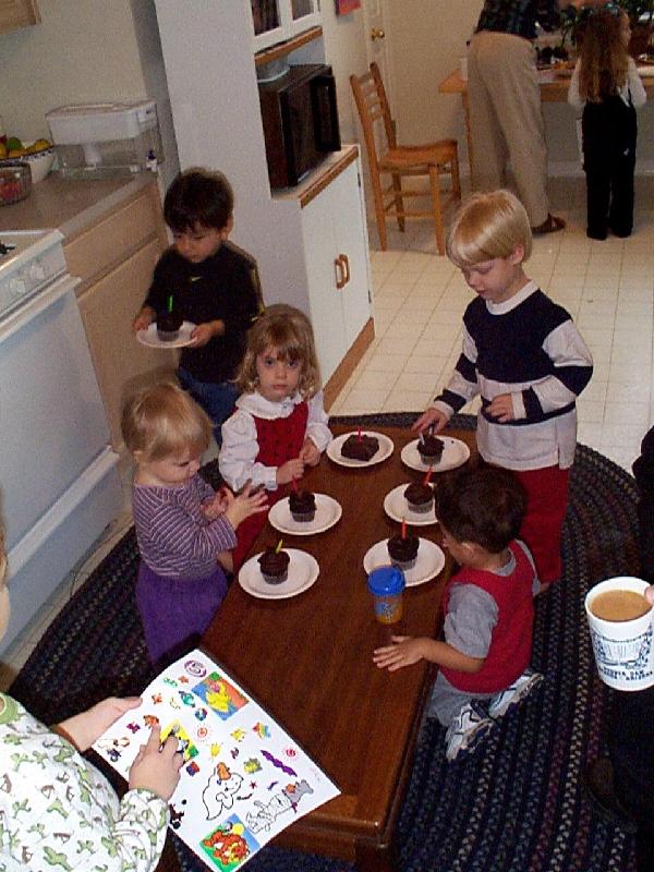 preparing for birthday cupcakes and singing