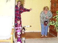 Gramma and Jada riding stick horses