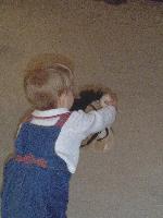 Jada showing us how to squeeze the stick horse's ear so he makes galloping sounds