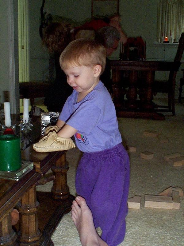 Jada walking her moccasins on the table