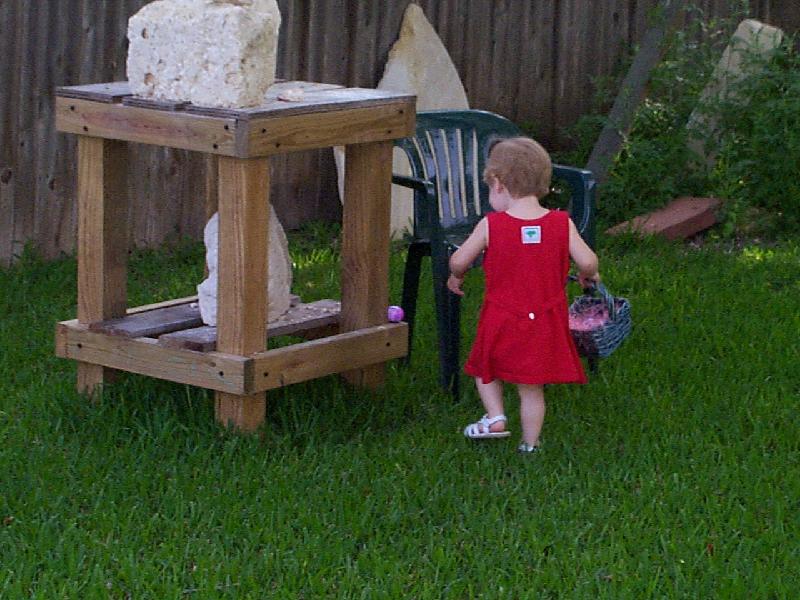 Jada makes a find on Papa's rock-carving table