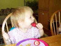 Jada with strawberry finger