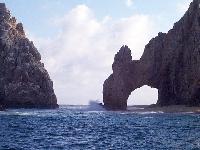 The Arch with a wave splashing up
