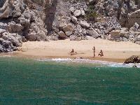 rolling in the surf on an almost-private beach