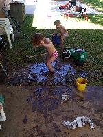 standing in the pit, and rinsing in the bucket