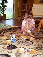 Jordan playing with the china that originally belonged to her Great-Grandma Mendell 