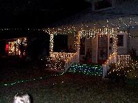 Nice house and the owners out on the porch