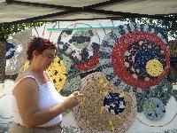 Julie hard at work setting tile 