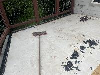 Scraping up the window seal that was used around the flashing and under each sleeper. 