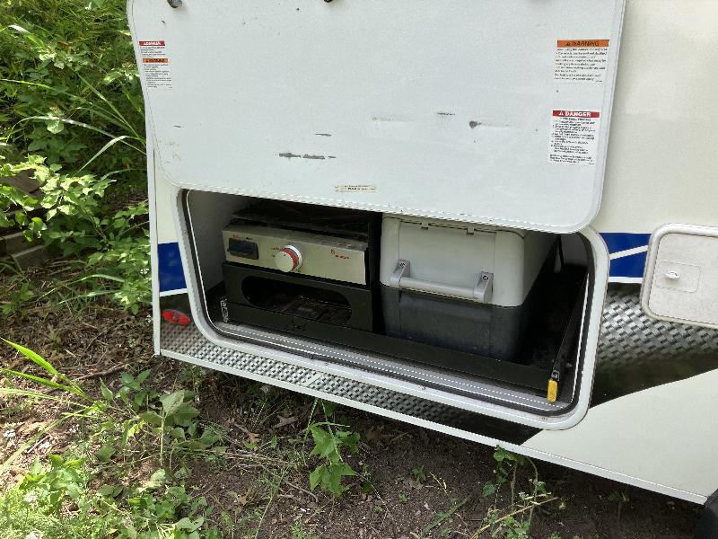 Griddle and cooler in stored position 