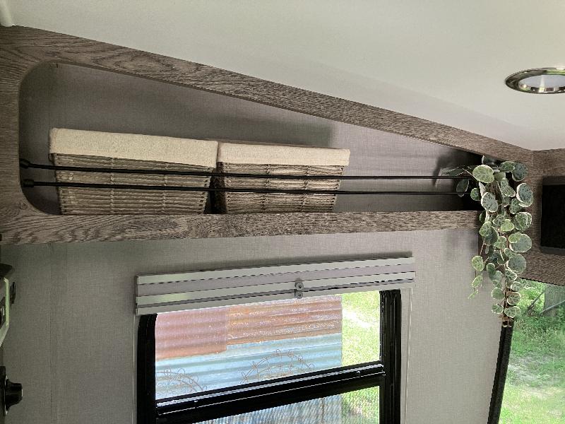We added these bungees to the upper storage areas. The storage bins and plants are included as well. 