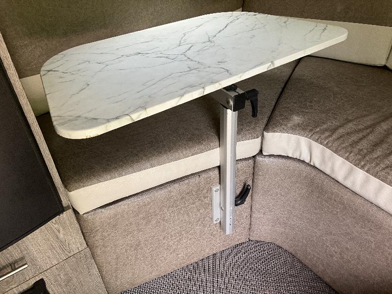 The stock table is a single pole in the middle of the floor. The Lagun table mount I added is much more flexible.  